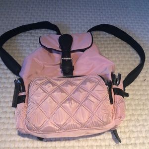 A small pink backpack